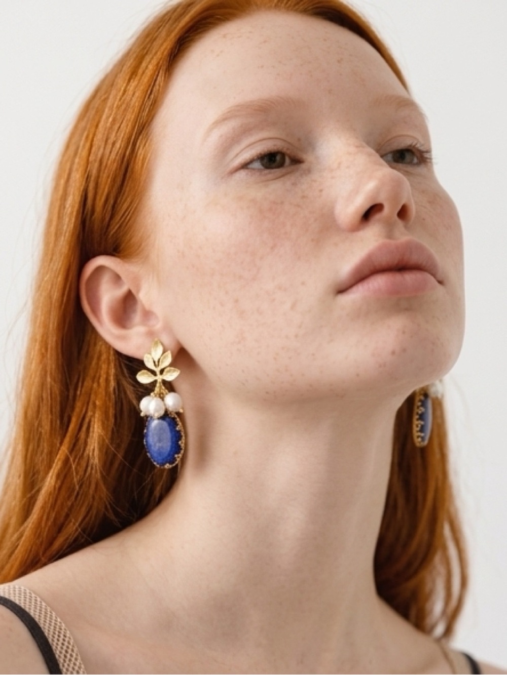 Gold Leaf Drop Earrings with Blue Stone and freshwater Pearls 18k go plated.